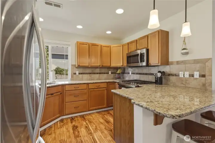 The 5 burner gas stove makes food prep a delight; ample counter space means sharing the load is easy! The 5 burner gas stove makes food prep a delight; ample counter space means sharing the load is easy!