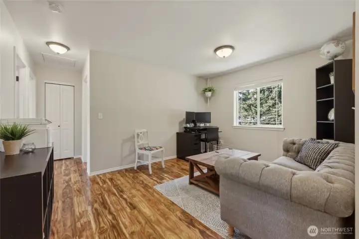 Upstairs loft family room is fabulous flex space! Window to backyard brings in light; laminate flooring maintains the easy care and quality element. Upstairs loft family room is fabulous flex space! Window to backyard brings in light; laminate flooring maintains the easy care and quality element.