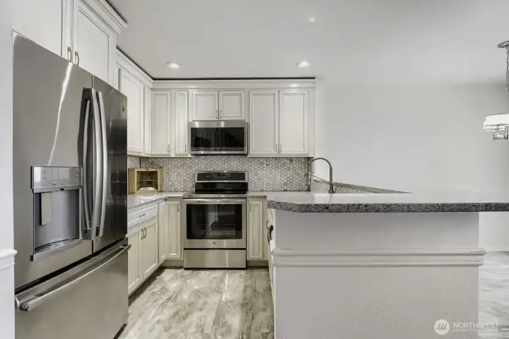 Beautifully updated kitchen with sleek finishes and stainless appliances.