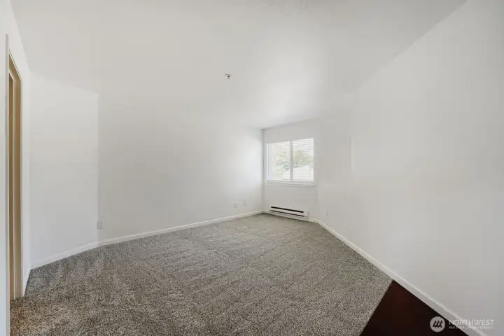 Light-filled primary suite designed for comfort and relaxation.