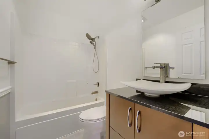 Bright, functional bathroom with updated fixtures and easy maintenance finishes.