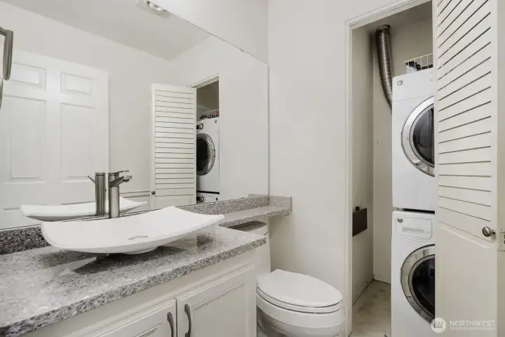 Full bath features modern finishes and in-unit laundry for added convenience.