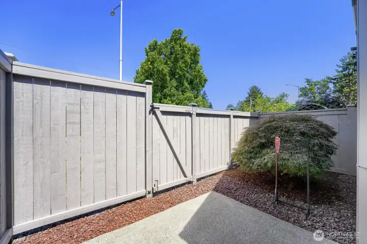 Fully fenced patio creates a private outdoor retreat for relaxing or entertaining.