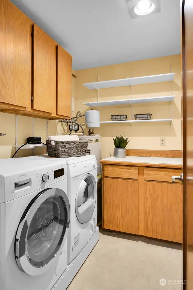 Large laundry room with storage. 2022 Water Heater