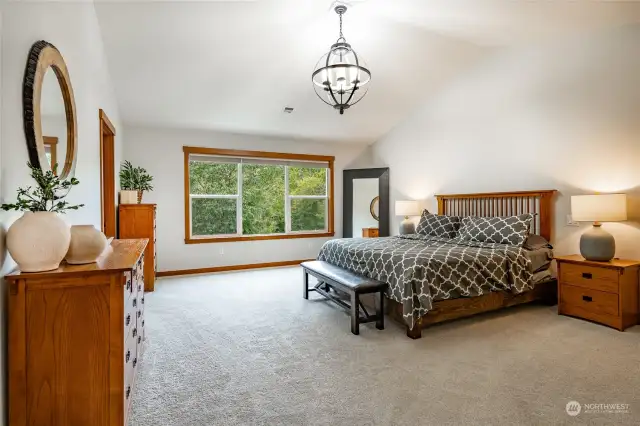 Huge primary bedroom with vaulted ceilings and gorgeous bathroom & walk-in closet.