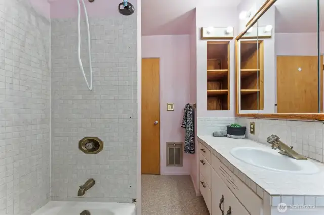 built in storage in full bathroom