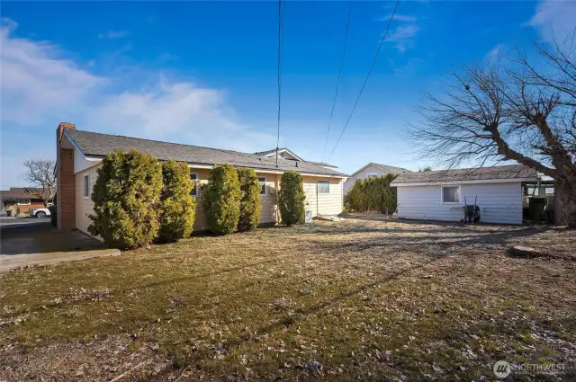 Large backyard, partially fenced.