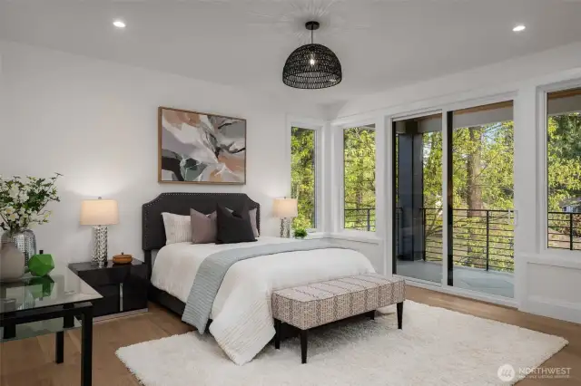 Spacious primary suite with attached balcony, one of three covered outdoor living spaces
