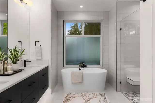 Picturesque primary bath featuring heated tile floors