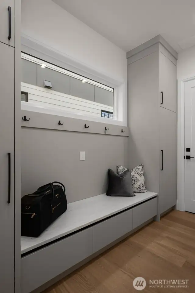 Mud room off the garage with plenty of custom storage