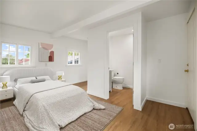 Main Floor Primary Bath with door to deck - virtually staged