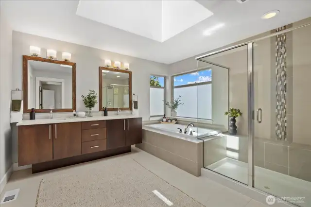 Beautifully light and open spa-like Primary bath with a huge skylight to offer natural light. Built in shower seat and an over-sized tub for extreme relaxation!