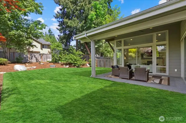 Fully fenced yard, an oasis of green grass, Sprinkler system front and back, room to plant and mature trees offer shade and privacy.