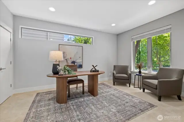 Main floor Den/Office/5th Bdrm with a full closet.