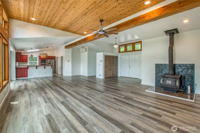 Entry opens to the living room and kitchen, and the office or exercise room is just around the corner.