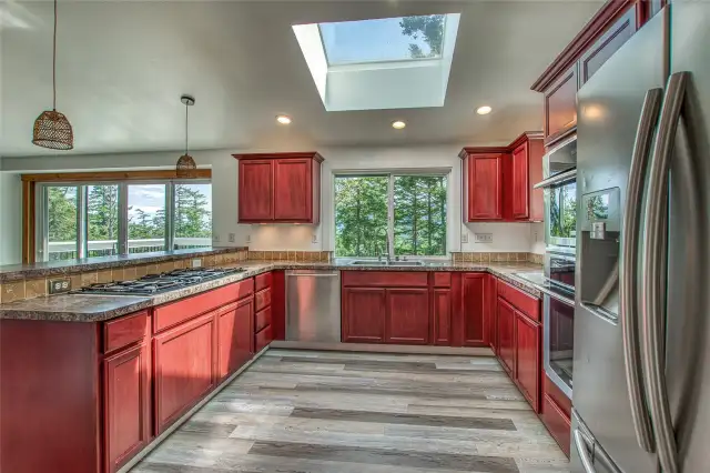 Another angle of the kitchen showing how it is filled with windows.
