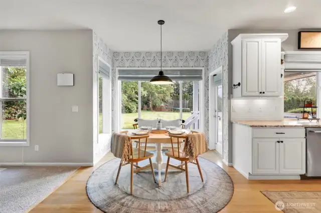 Dining Nook leads to covered back deck & beautiful back yard.