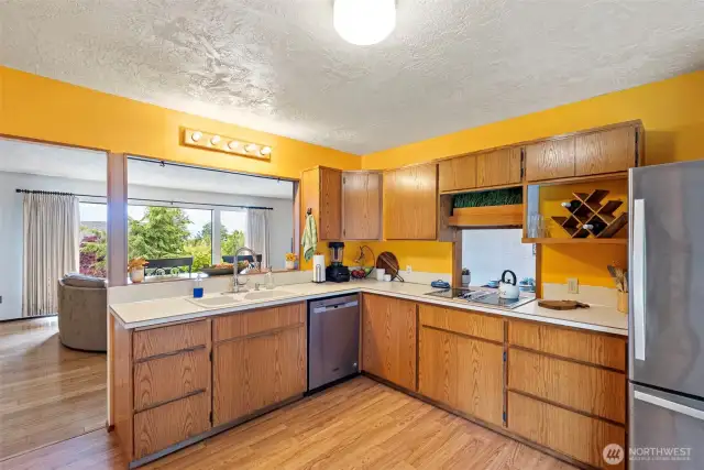 Open to living room, dinning room and back patio makes this home perfect for enertaining year round!