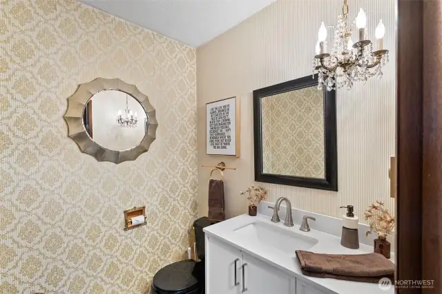 Half bath off of potential primary bedroom or den.