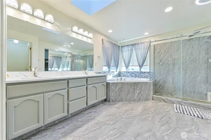 Enjoy your primary bathroom with large soaking tub and walk in shower!