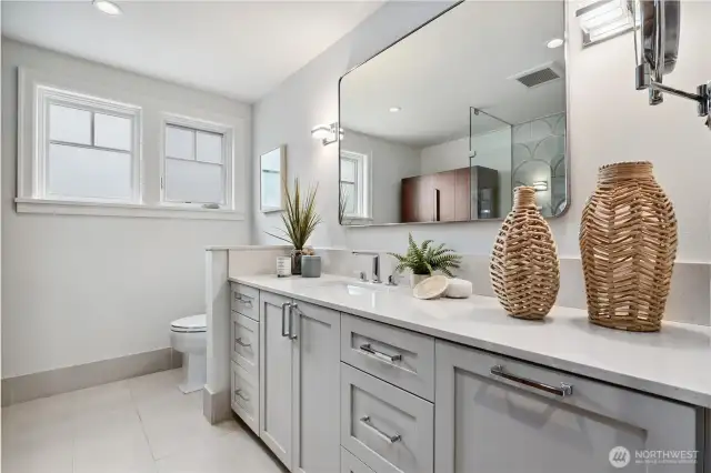 The primary bath is very pretty and neutral. Double sinks and great storage.