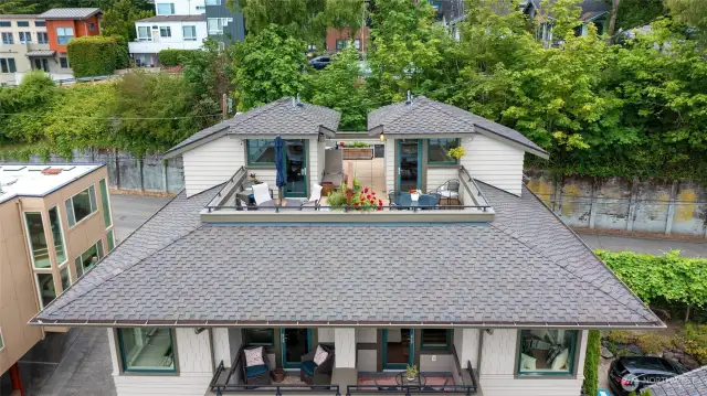 The rooftop deck and deck off the living room are incredible! The views, space and sunshine is wonderful! 1/2 ownership with neighbor, the space is currently divided by greenery.