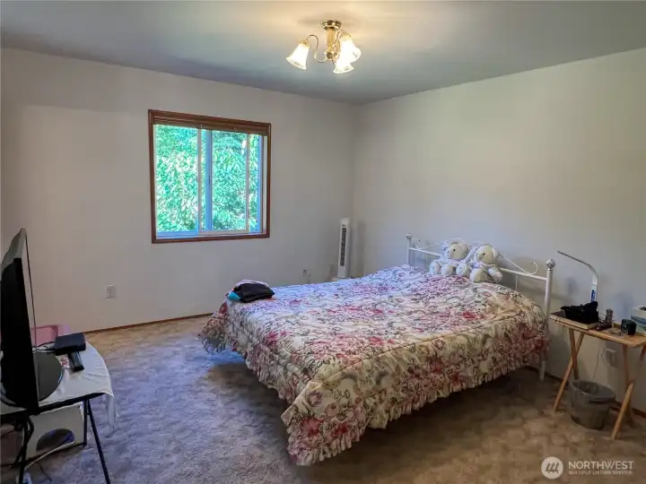 Then upstairs is the Primary Bedroom. bath is left of the window
