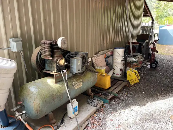 Tractor stays and the 2 2500 gal catchment tanks