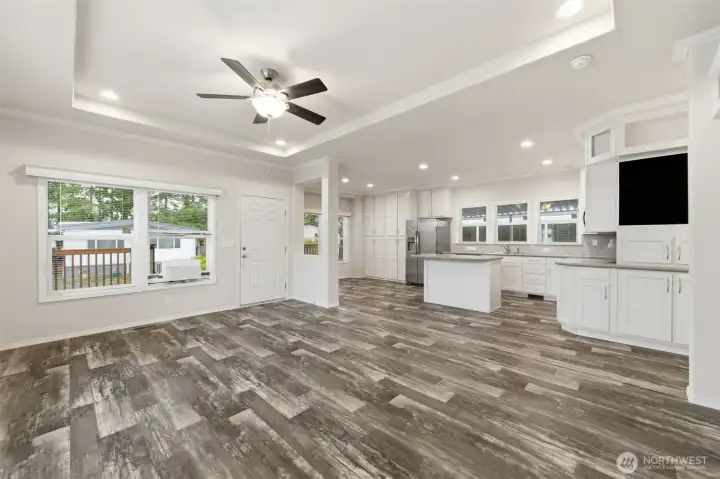 Enjoy the open, airy feel of the living room with wide windows that bring in natural light and a peaceful view.