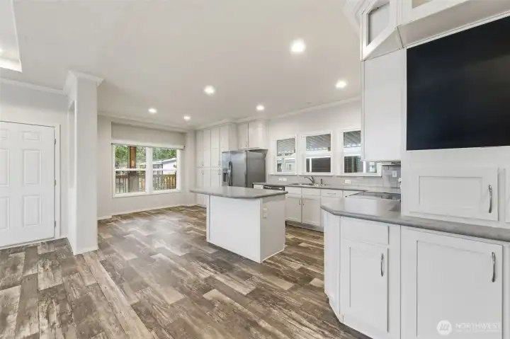 Open-concept design connects the living and kitchen areas—ideal for entertaining or staying engaged while cooking.