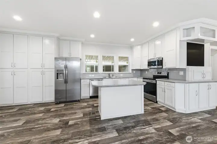 Beautifully designed kitchen showcases stainless steel appliances, abundant cabinetry/storage, and modern finishes.