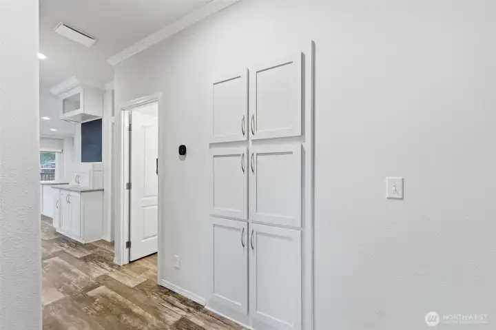 Wide hallway with added storage makes for easy movement and smart organization throughout the home.