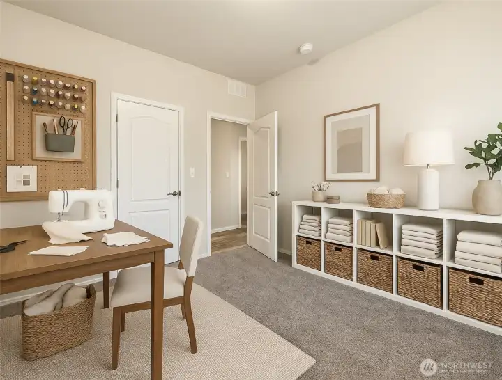 Versatile third bedroom can easily serve as a hobby room, craft space, or comfortable flex area. (Photo virtually staged)