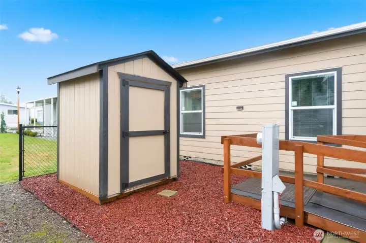 Matching storage shed adds functionality and blends seamlessly with the home’s exterior.