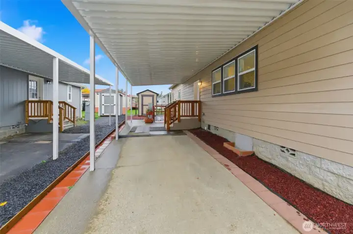 Long covered parking area provides generous space for vehicles, guests, or easy loading and unloading.