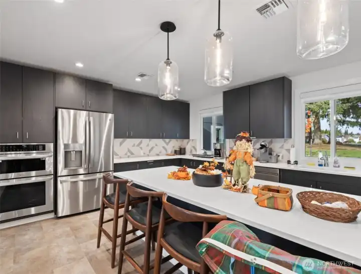 Beautifully designed community kitchen with modern finishes—perfect for potlucks, gatherings, and special events.