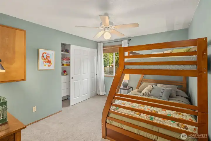 Spacious 3rd bedroom with closet with quality built-in organizers.