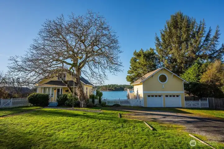 The farm cottage on the left, newer garage with loft apartment on the right