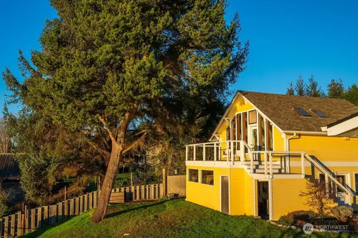 West/water side of garage/loft studio, with garden storage area underneath