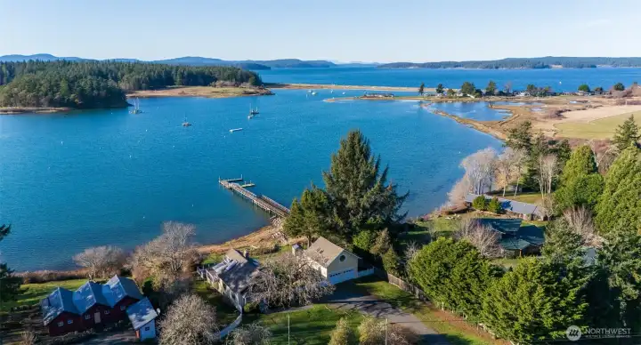 Aerial overlooking property to the northwest, the entrance to Fisherman Bay, Upright Channel, and Shaw Island. The Spit Preserve (Lopez Island) in upper left/middle