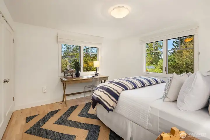2nd bedroom has western and northwestern facing windows with winter whisper views of lake