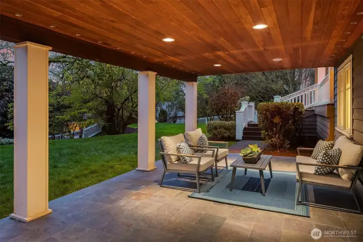 This gorgeous covered patio is a wonderful spot to linger long into the night with friends while the yard gives so many non tech options