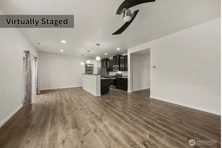 Living room & Kitchen. Photo has been edited to remove furniture.