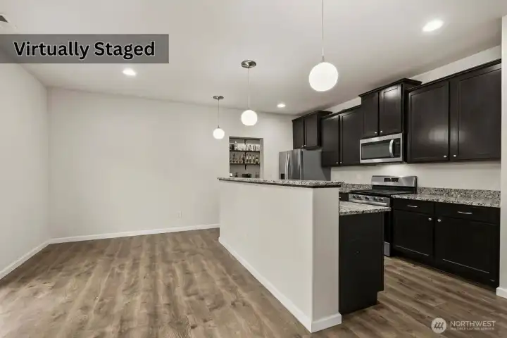 Dining room & Kitchen. Photo has been edited to remove furniture.
