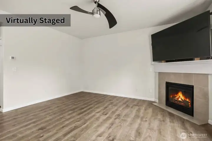 Living room with fireplace. Photo has been edited to remove furniture.