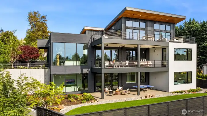 Generous outdoor spaces on every level with a secure private yard.