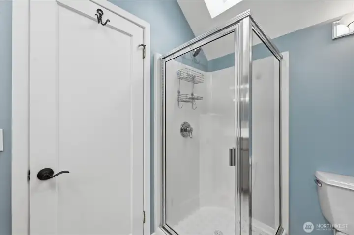 Sky-lit primary bathroom. Sky-lit primary bathroom.