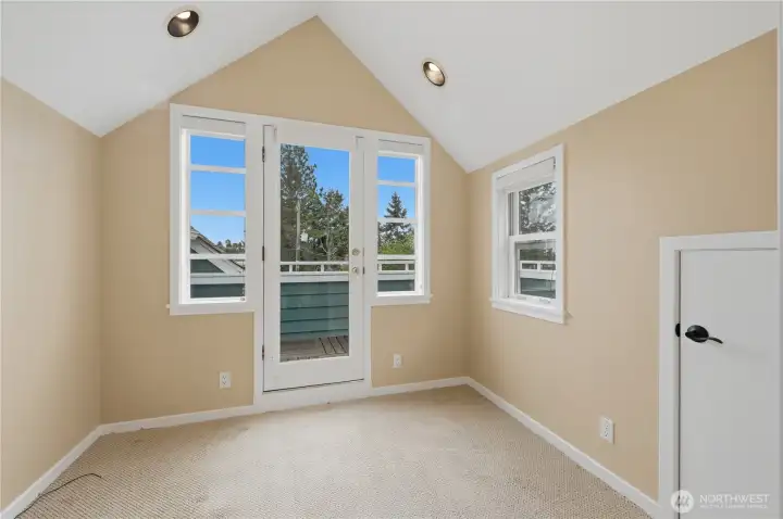 Den with access to a view deck. Den with access to a view deck.