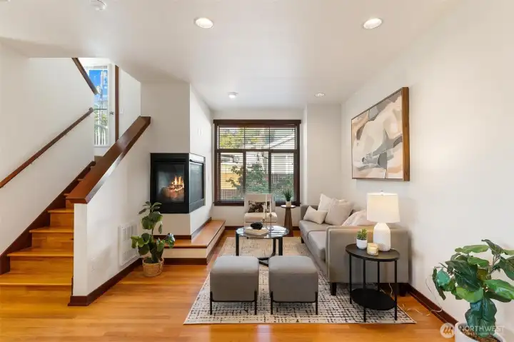 Spacious living area with oversized windows bringing in abundant natural light.