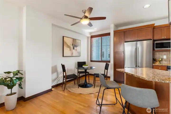 Dining area adjacent to the kitchen with an open and functional layout.